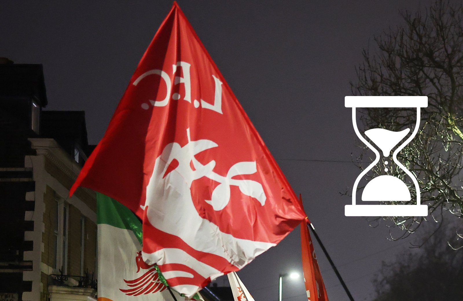 A Liverpool flag waves in the air next to an hourglass symbol.