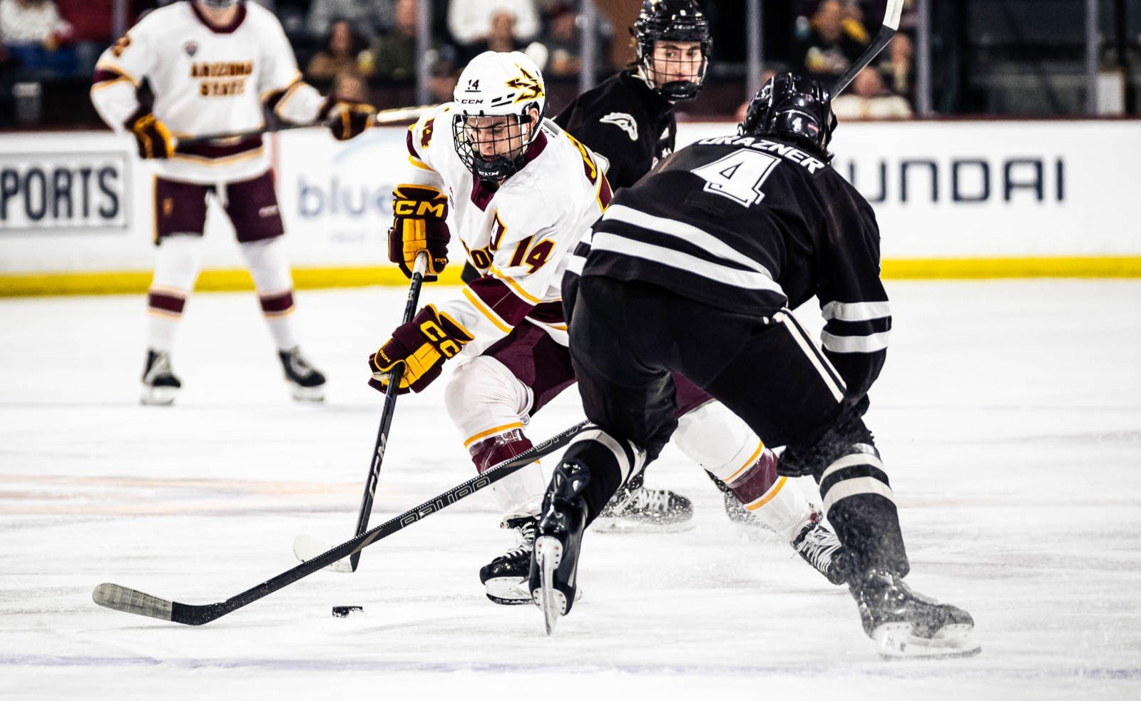 FRIDAY COLLEGE HOCKEY ROUNDUP: No. 12 Arizona State drops No. 3 Western Michigan; Northeastern upsets No. 9 Boston University; No. 18 Penn State ties No. 1 Michigan State; No. 2 Boston College doubles up Vermont; No. 11 UConn nips No. 4 Maine in OT - College Hockey