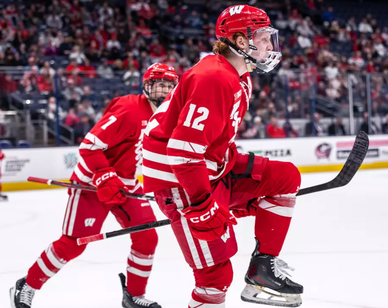 FRIDAY COLLEGE HOCKEY ROUNDUP: Three upsets to open B1G playoffs as Wisconsin, Notre Dame and Penn State all win on the road; AIC steals Game 1 at Holy Cross; UMass upsets Maine; Denver beats rival Colorado College - College Hockey