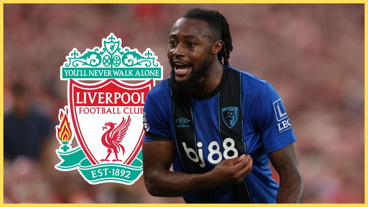 Antoine Semenyo tugs at his Bournemouth shirt next to Liverpool club crest.