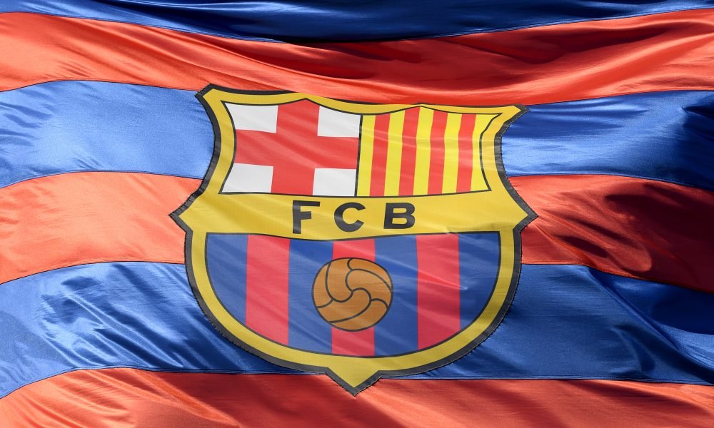 BARCELONA, SPAIN - APRIL 04: The Barcelona logo is seen on a flag waving above the stadium prior to the UEFA Champions League Quarter Final Leg One match between FC Barcelona and AS Roma at Camp Nou on April 4, 2018 in Barcelona, Spain. (Photo by Mike Hewitt/Getty Images)